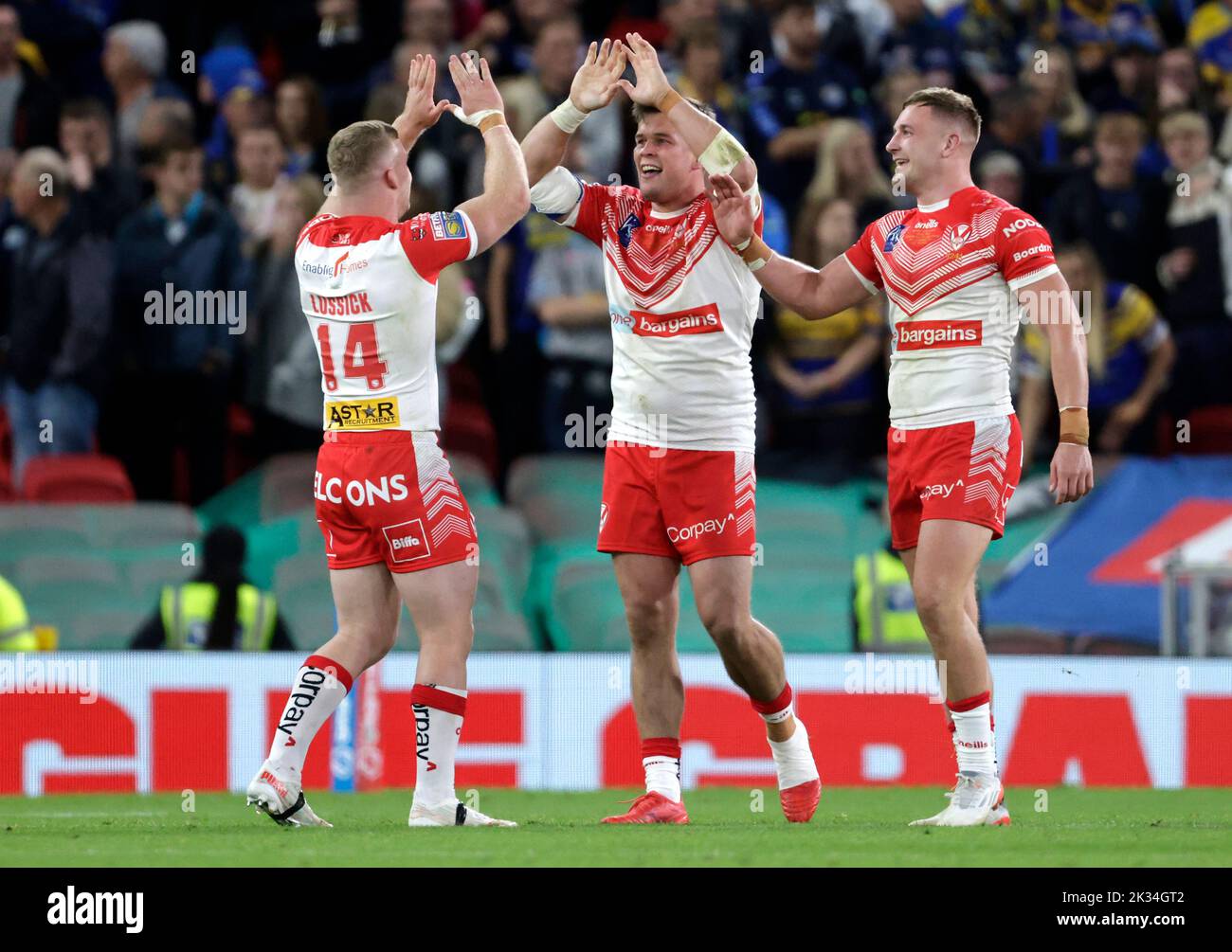St Helens' Joey Lussick (left) and team-mates celebrate victory in the Betfred Super League Grand Final at Old Trafford, Manchester. Picture date: Saturday September 24, 2022. Stock Photo