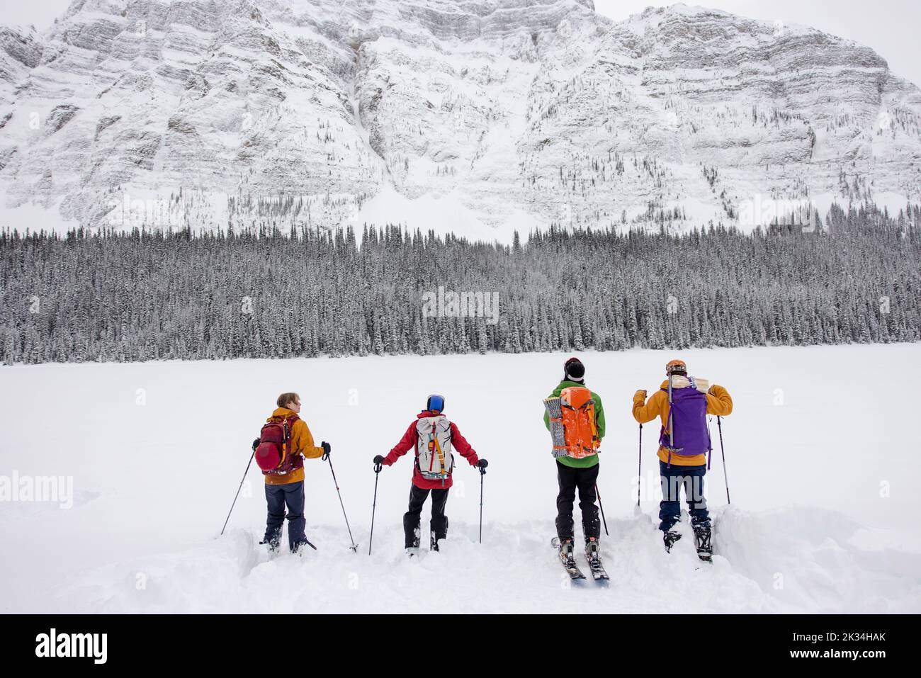 Friends backcountry skiing in majestic Canadian Rocky Mountains Stock Photo