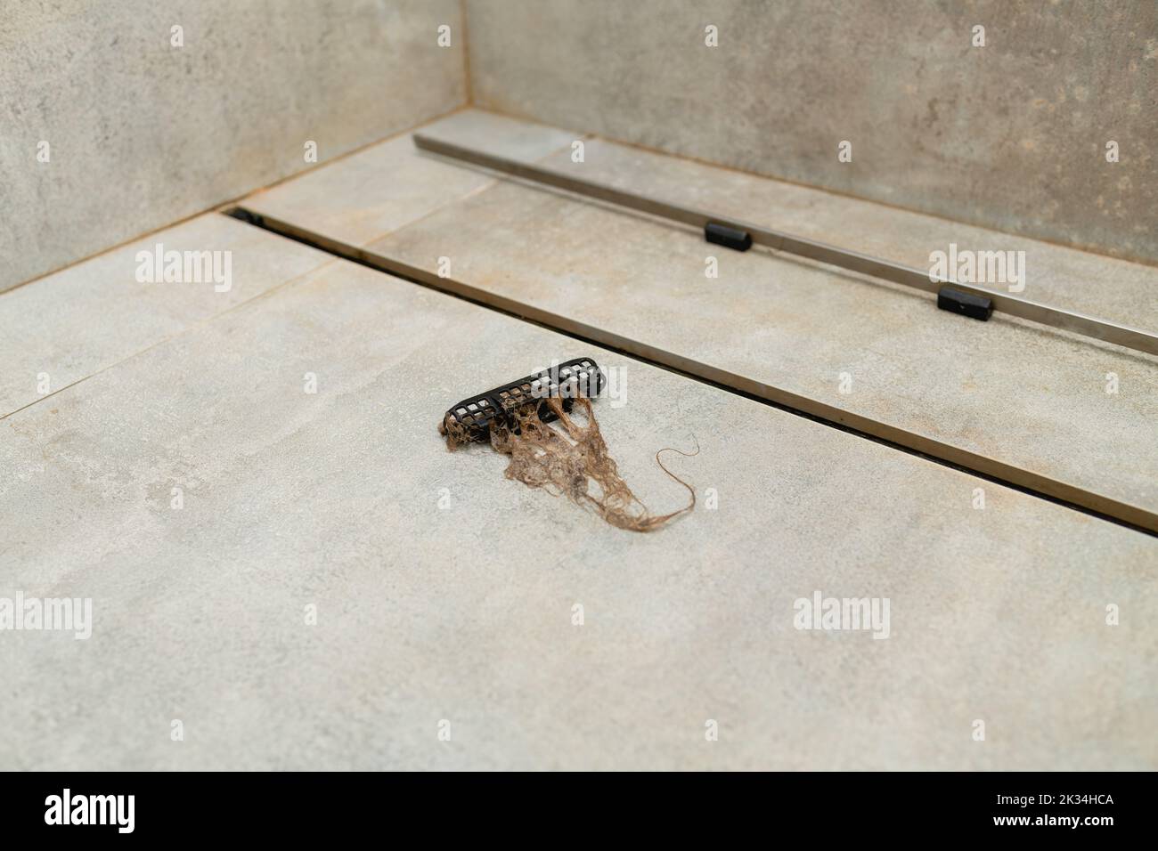 Hair clogs shower drain. Removing hair clump from the shower drain