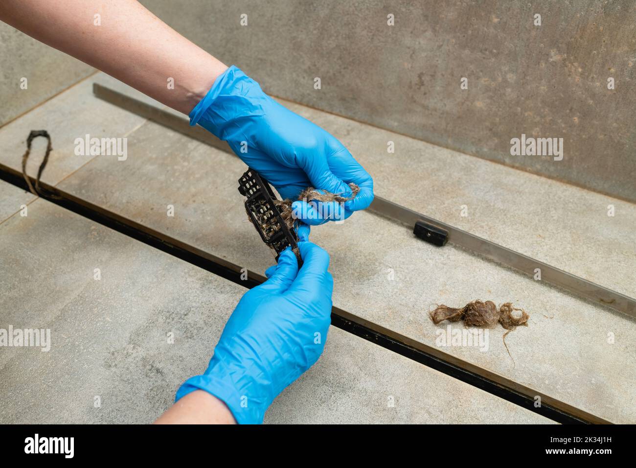 remove hair from the shower drain, Stock Video