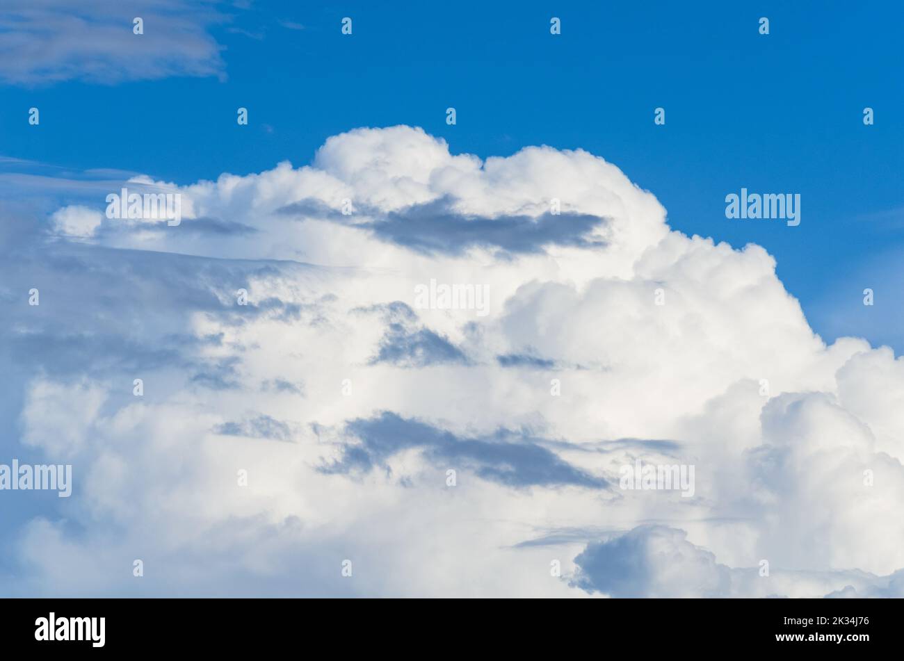 White fluffy cumulus clouds and blue sky Stock Photo