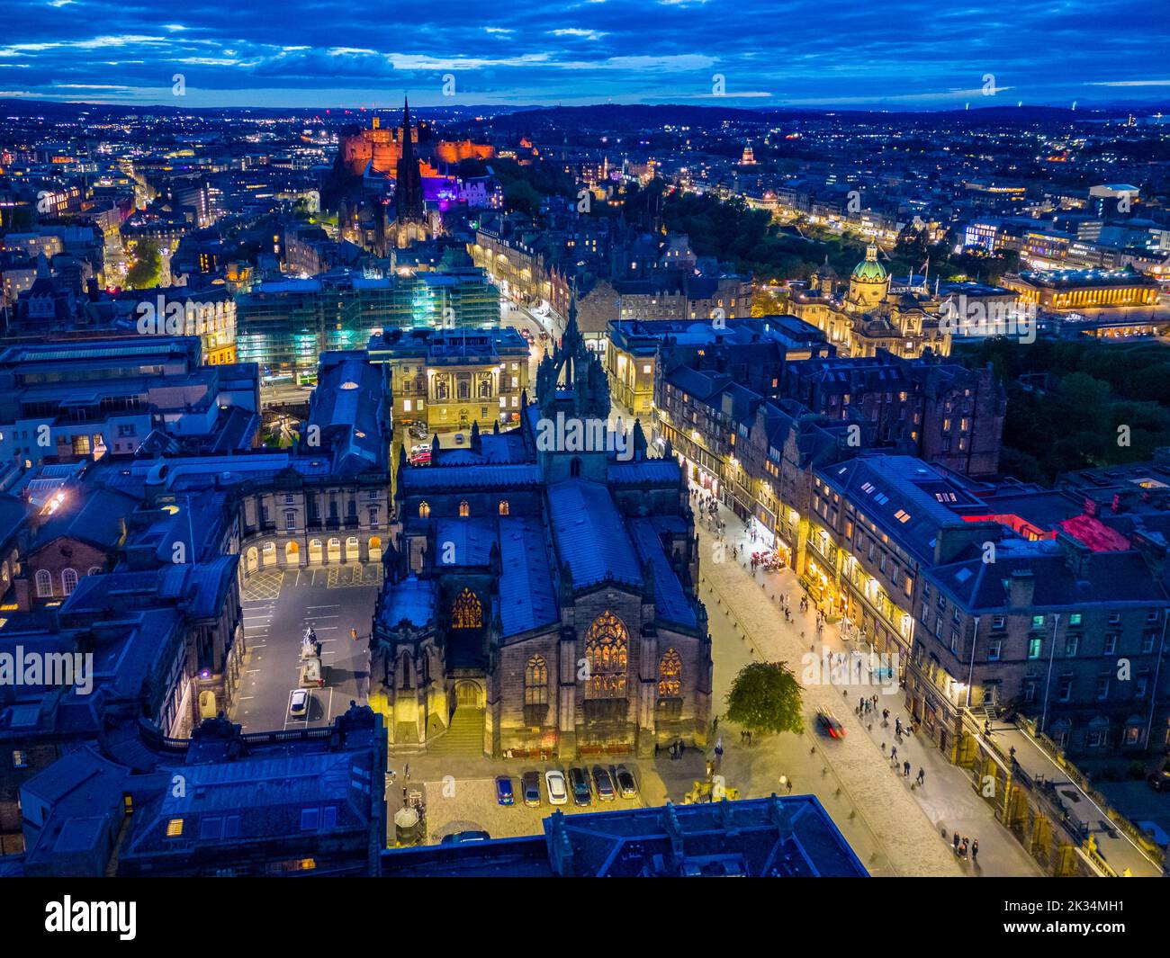 Edinburgh, Scotland, UK. 24th September 2022. Aerial view at night of the Royal Mile two weeks after Queen Elizabeth II lay inside St Giles Cathedral and thousands of people lined the street. The Royal Mile is now back to normal and still busy with the usual heavy influx of tourists.  Iain Masterton/Alamy Live News Stock Photo