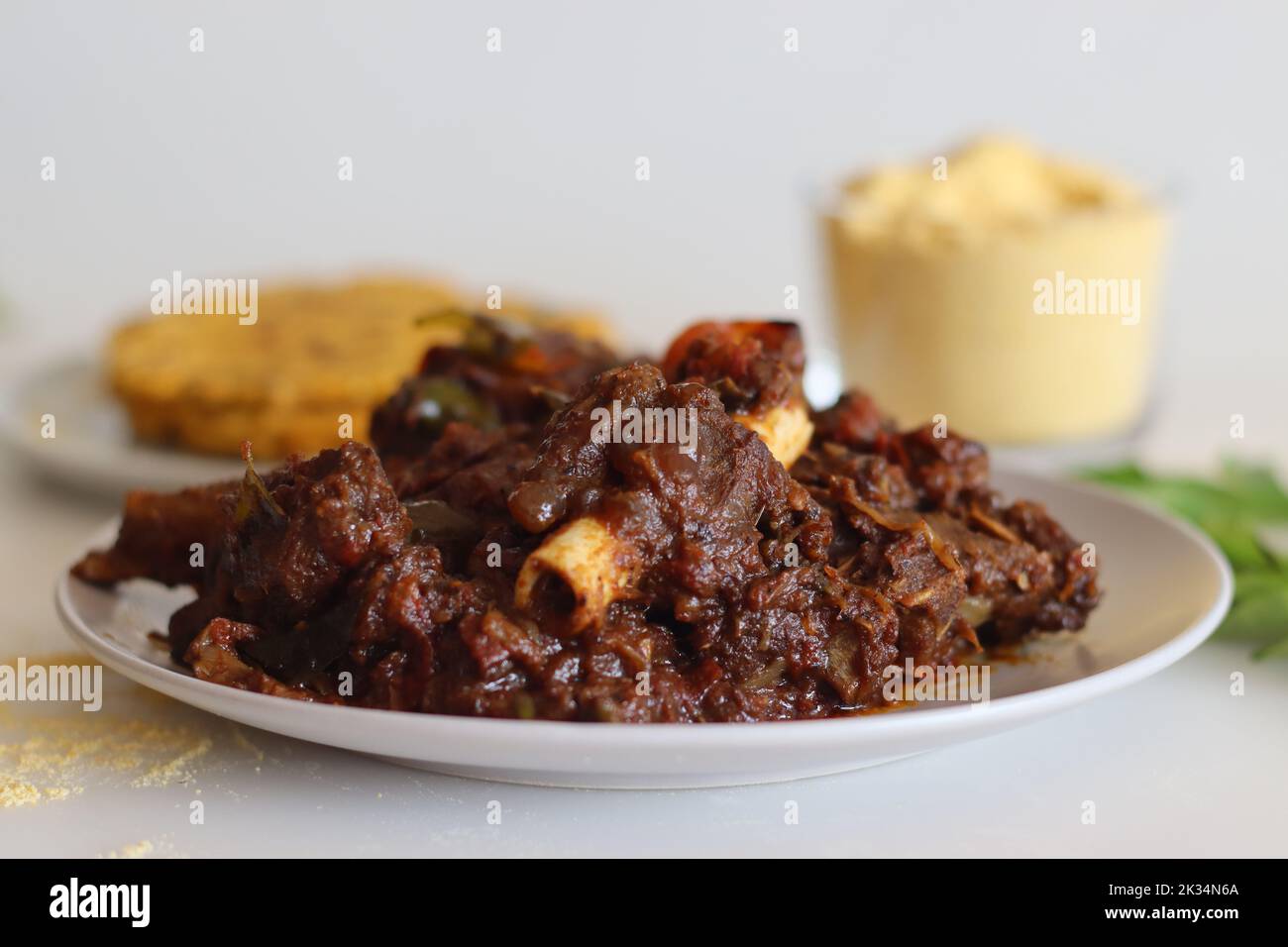 Mutton roast served with Makki ki roti or Maize roti. Spicy mutton roast prepared in Kerala style served with Indian flat unleavened bread made from c Stock Photo