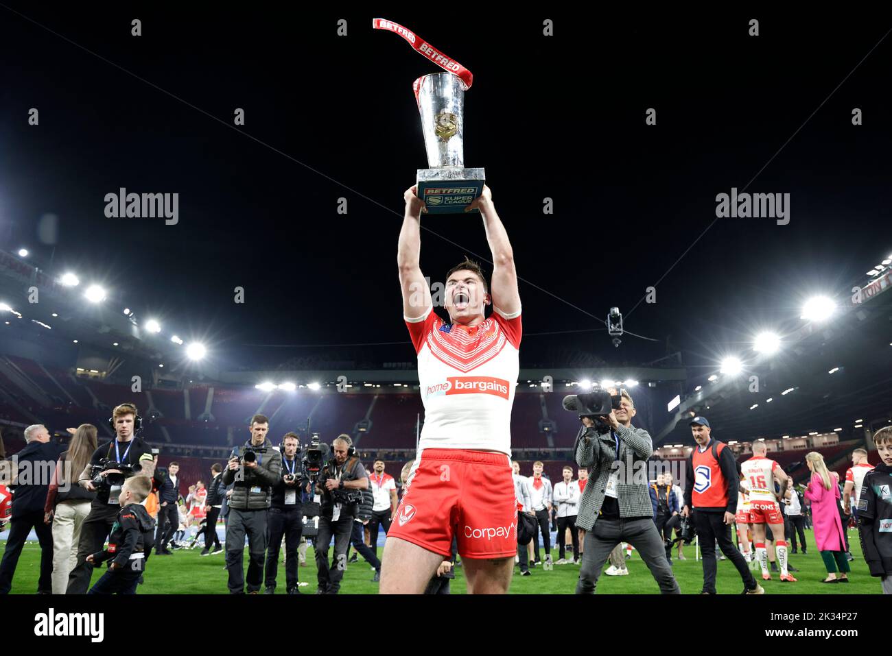 St Helens' Jack Welsby celebrates with the trophy after victory in the Betfred Super League Grand Final at Old Trafford, Manchester. Picture date: Saturday September 24, 2022. Stock Photo