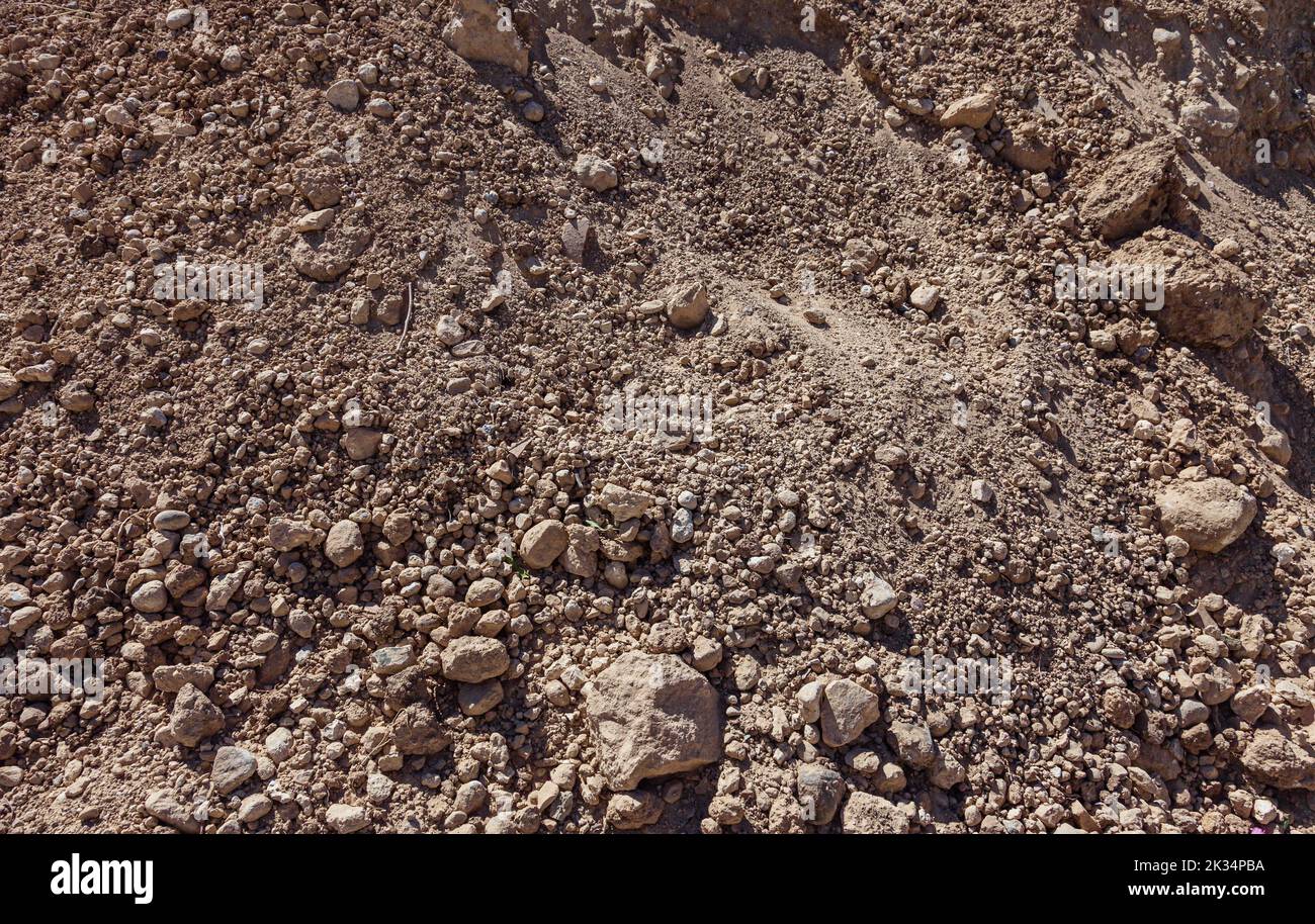 Heap of earth and small stones inside. Dried earth. Stock Photo