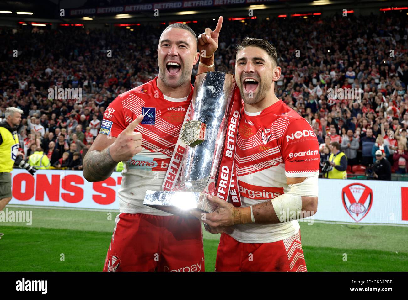 St Helens' Curtis Sironen (left) and Tommy Makinson celebrate with the trophy after victory in the Betfred Super League Grand Final at Old Trafford, Manchester. Picture date: Saturday September 24, 2022. Stock Photo