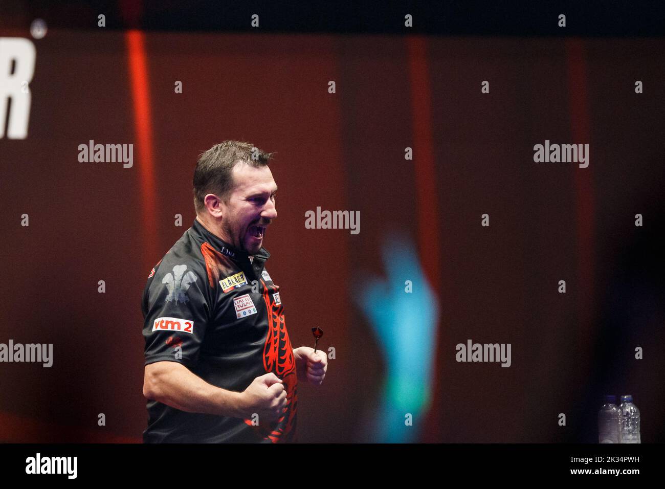 Welsh Jonny Clayton celebrates after winning the second day of the