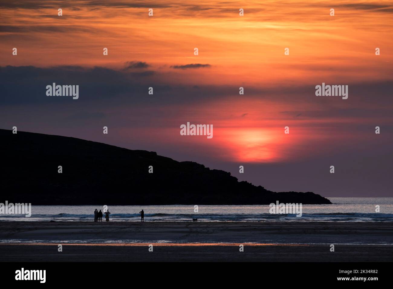 Sunset on Crantock beach in North Cornwall looking out to the Atlantic Ocean. Stock Photo