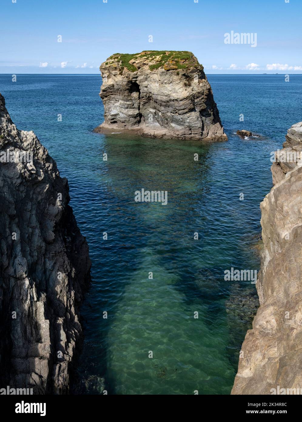 Rocks and cliffs on the north Cornwall coast at the small village of Porth, England. Stock Photo