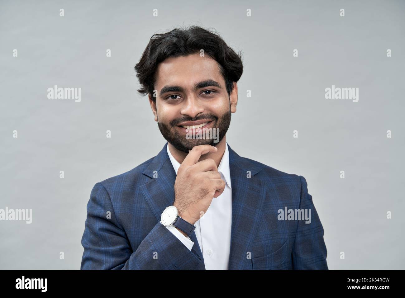 Happy young indian arab business man wearing suit. Headshot portrait Stock Photo