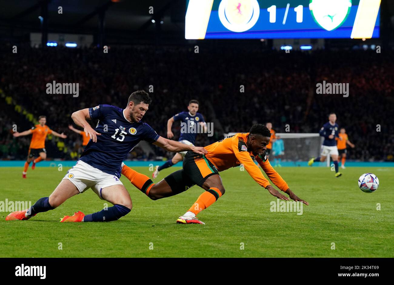 Scotland's Scott McKenna (left) fouls Republic of Ireland's Chiedozie Ogbene, for which he receives a yellow card for, during the UEFA Nations League Group E Match at Hampden Park, Glasgow. Picture date: Saturday September 24, 2022. Stock Photo