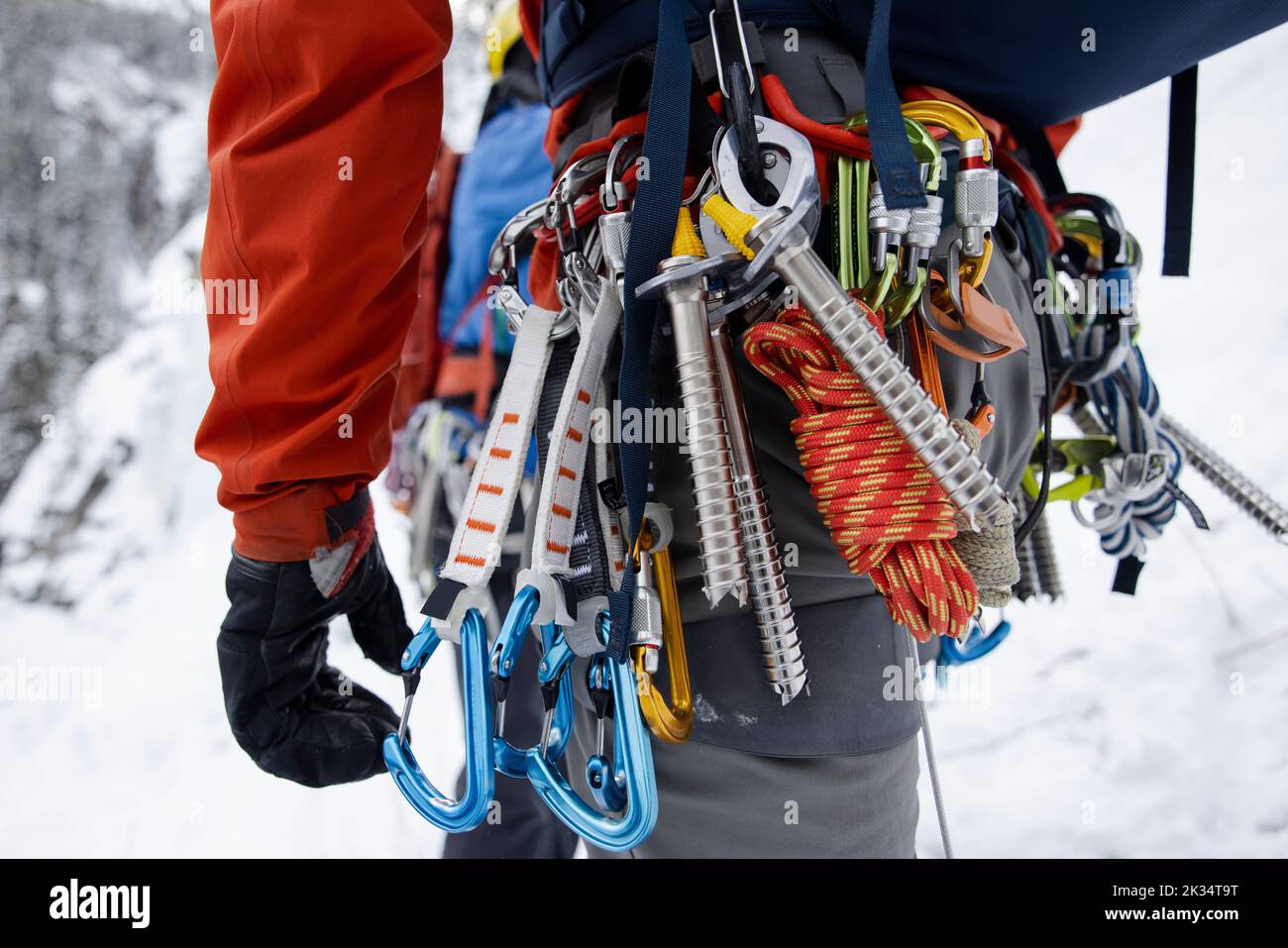 Ice climber wearing harness with belay device Stock Photo Alamy