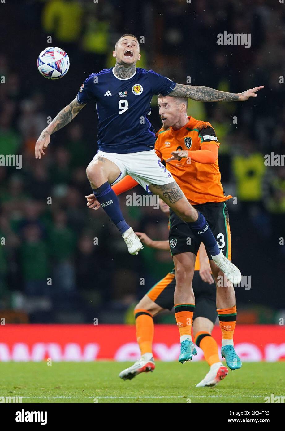 Scotland's Lyndon Dykes (left) and Republic of Ireland's Matt Doherty battle for the ball during the UEFA Nations League Group E Match at Hampden Park, Glasgow. Picture date: Saturday September 24, 2022. Stock Photo