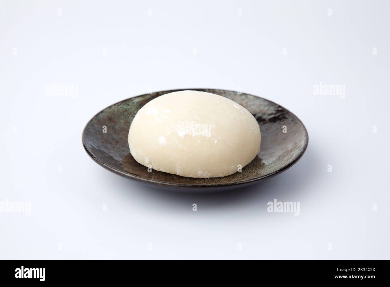 plain rice cake on plate isolated on white background Stock Photo - Alamy