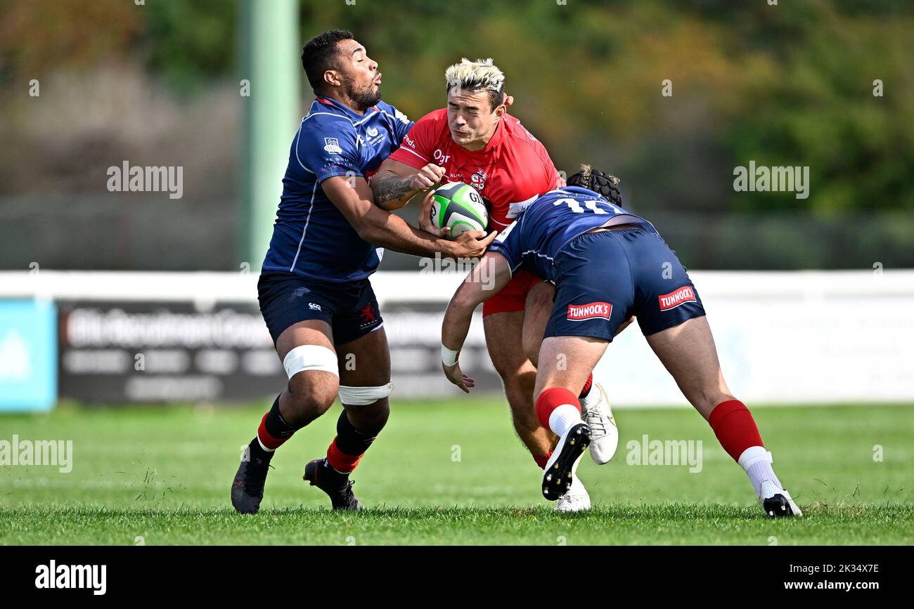 Richmond, United Kingdom. 24th Sep, 2022. Championship Rugby. London Scottish V Jersey Reds. The Richmond Athletic Ground. Richmond. Dan Barnes (Jersey Reds) is tackled by Harry Sheppard (London Scottish, 10) and Cameron King (London Scottish) during the London Scottish V Jersey Reds championship rugby match. Credit: Sport In Pictures/Alamy Live News Stock Photo