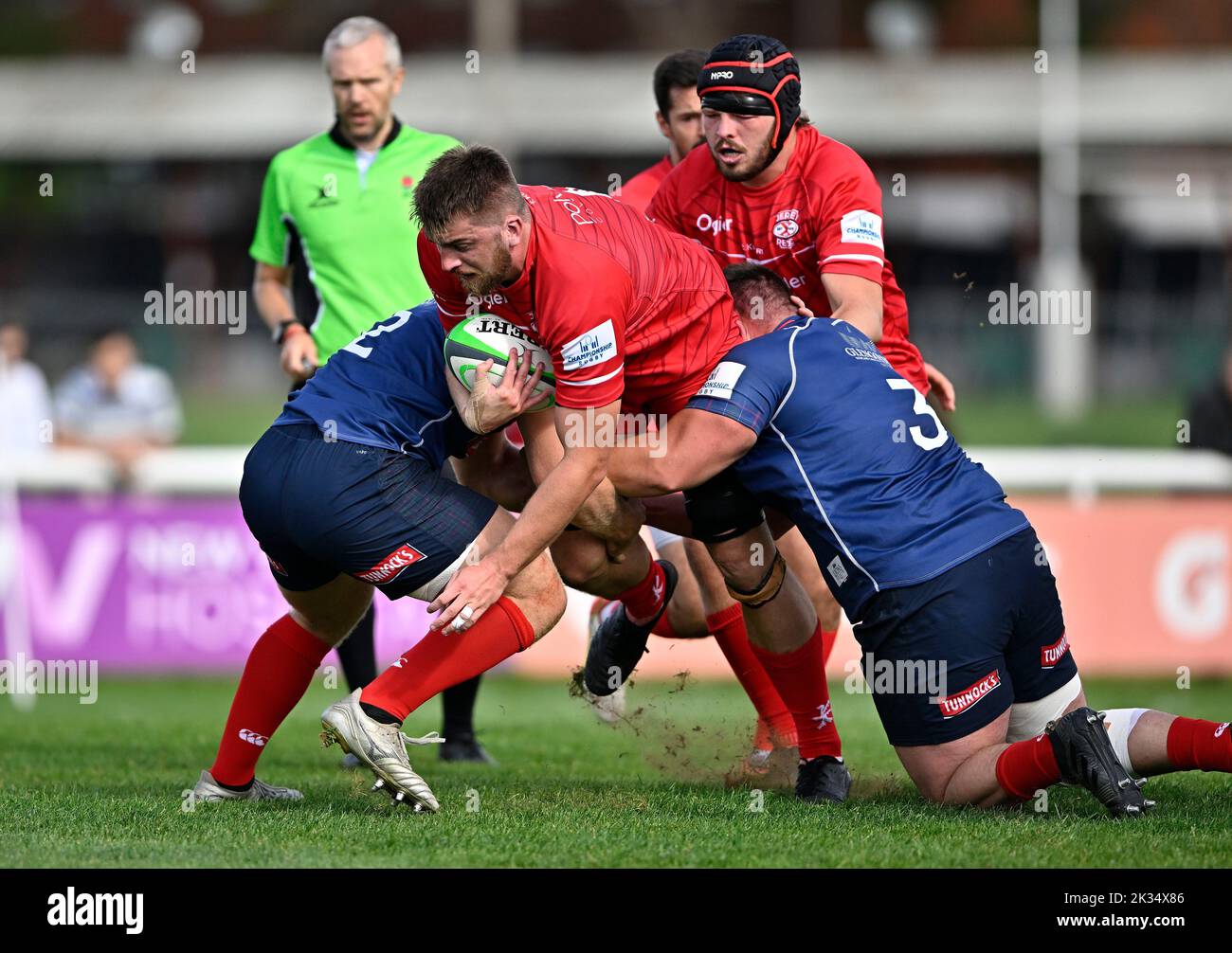 Richmond, United Kingdom. 24th Sep, 2022. Championship Rugby. London Scottish V Jersey Reds. The Richmond Athletic Ground. Richmond. Hamish Bain (Jersey Reds) is tackled by Joe Rees (London Scottish, captain, 3) and Austin Wallis (London Scottish) during the London Scottish V Jersey Reds championship rugby match. Credit: Sport In Pictures/Alamy Live News Stock Photo