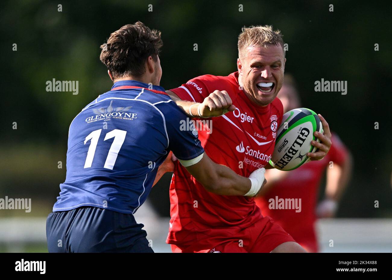 Richmond, United Kingdom. 24th Sep, 2022. Championship Rugby. London Scottish V Jersey Reds. The Richmond Athletic Ground. Richmond. Ben Woollett (Jersey Reds) tries to get past Josh Gillespie (London Scottish) during the London Scottish V Jersey Reds championship rugby match. Credit: Sport In Pictures/Alamy Live News Stock Photo
