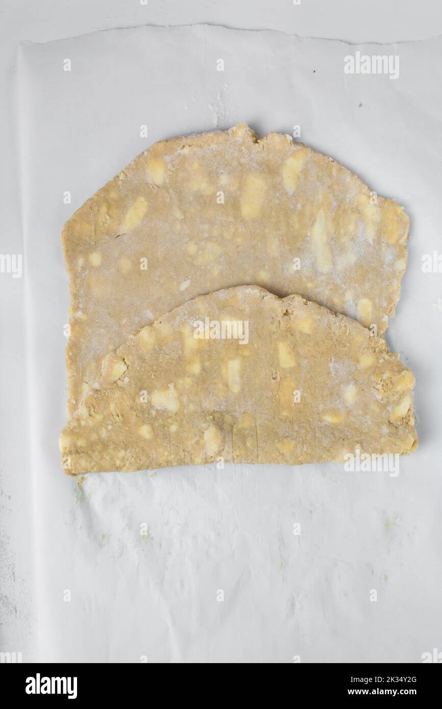 danish pastry dough being laminated, pastry dough with pieces of cold