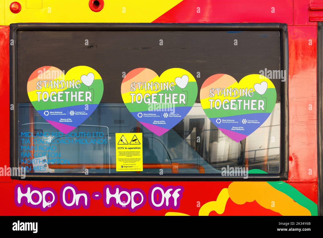 standing together heart stickers decals in bus window at Gay Pride parade protest 2022 in birmingham city centre uk september 24th Stock Photo