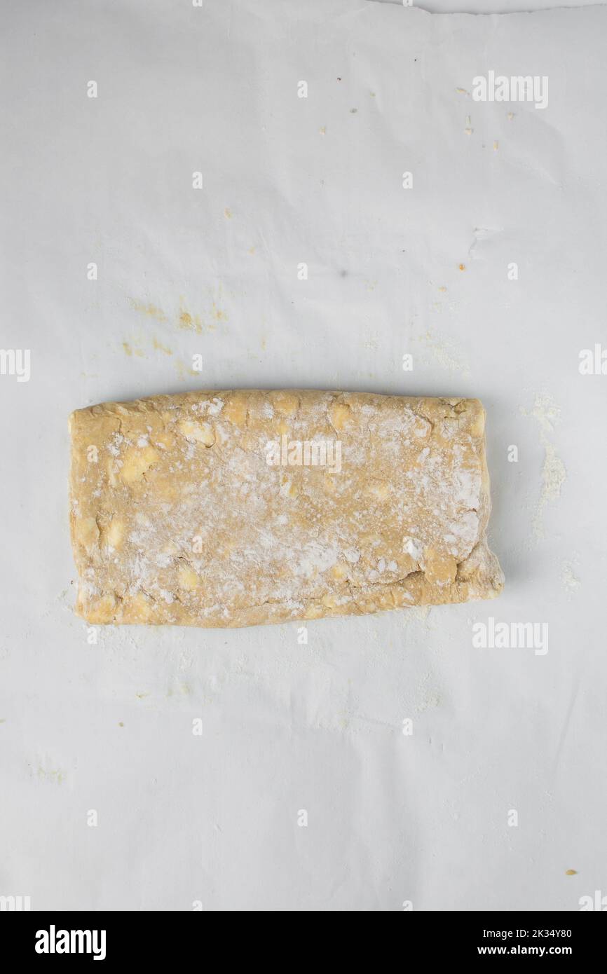danish pastry dough being laminated, pastry dough with pieces of cold