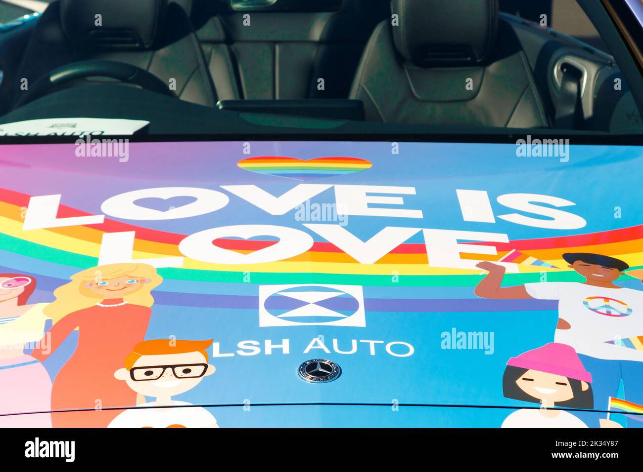 close up of bonnet decals love is love convertible Mercedes with decals at Gay Pride parade protest 2022 in birmingham city centre uk september 24th Stock Photo