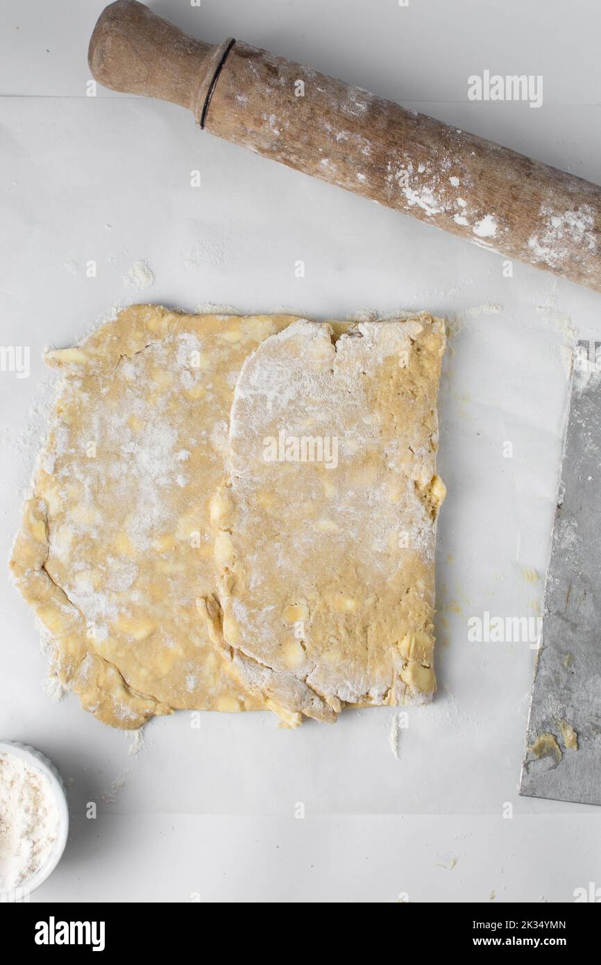 danish pastry dough being laminated, pastry dough with pieces of cold
