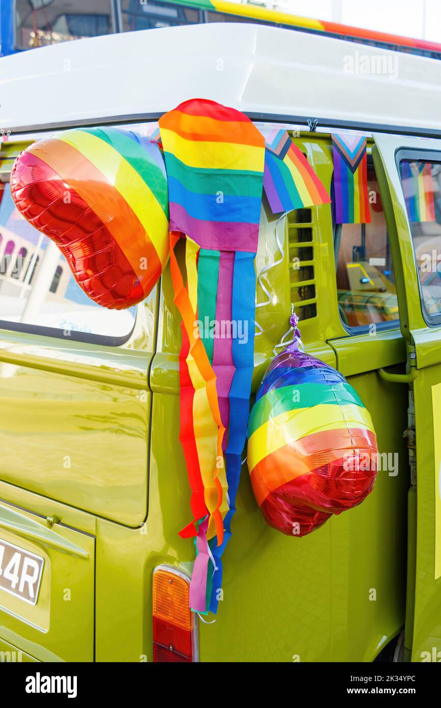 green volkswagen bus kombi decorated with rainbow heart balloons at Gay Pride parade protest 2022 in birmingham city centre uk september 24th Stock Photo