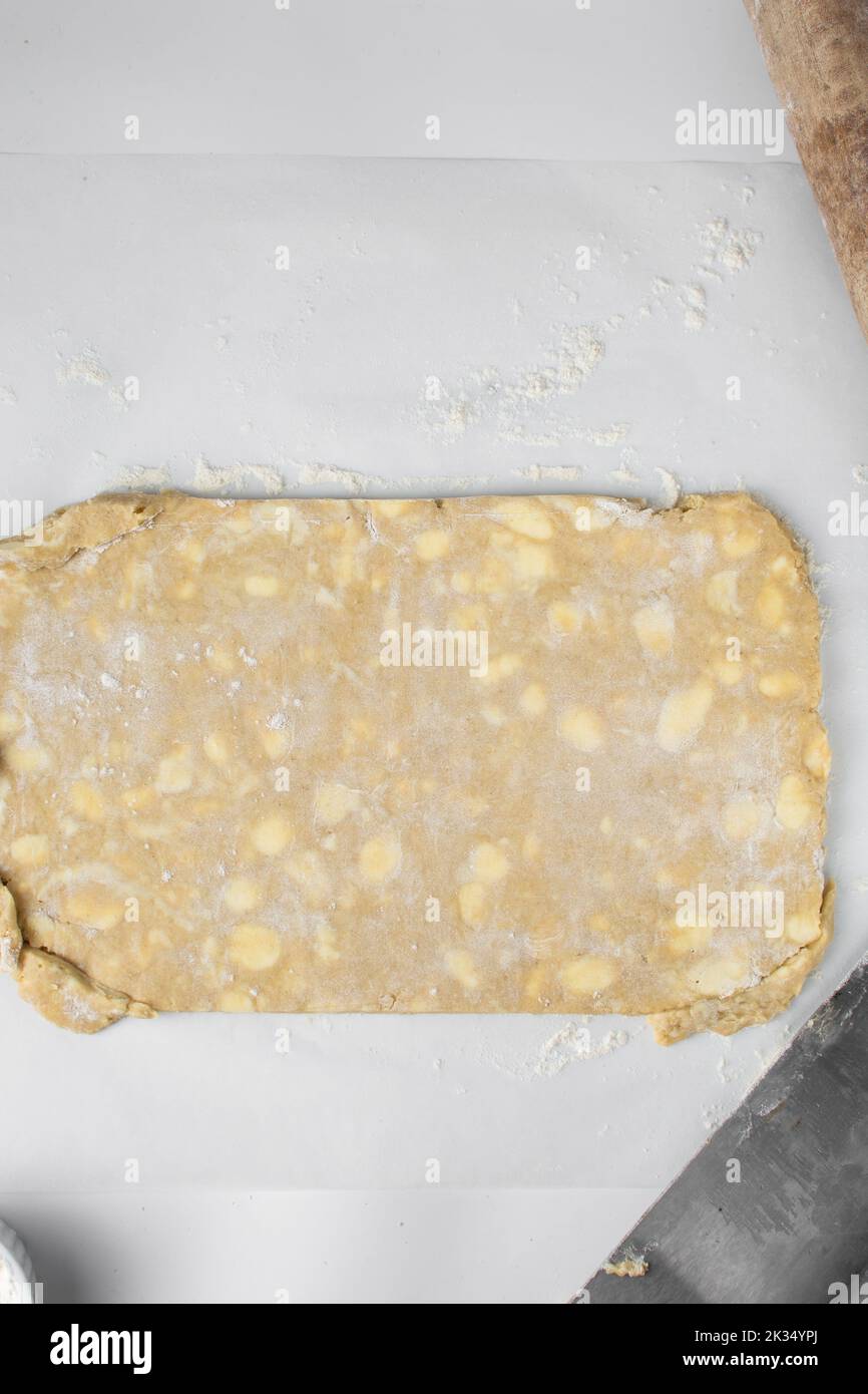 danish pastry dough being laminated, pastry dough with pieces of cold