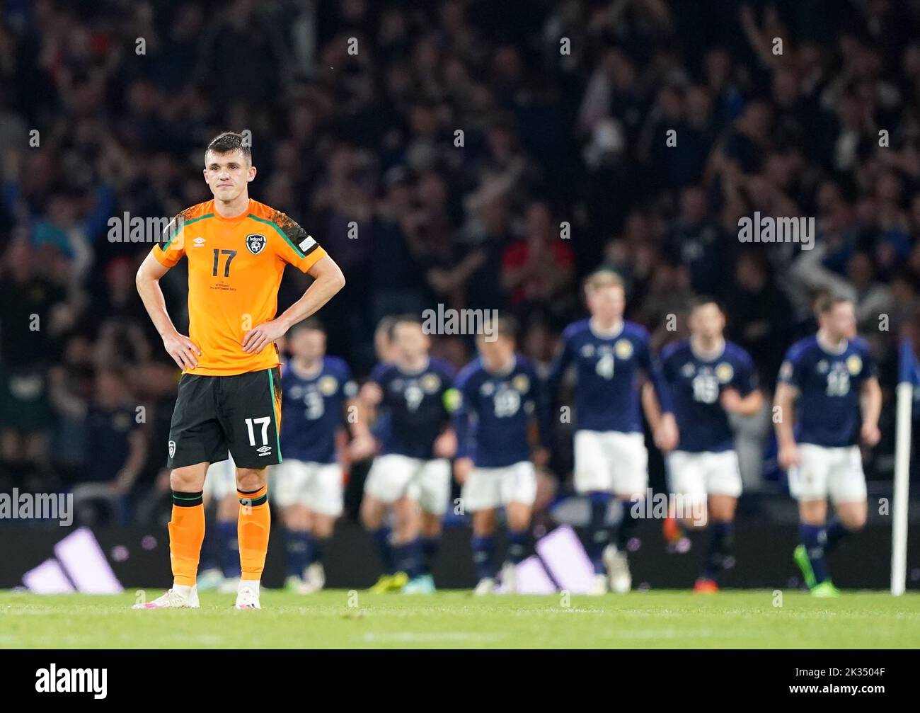 Republic of Ireland's Jason Knight (left) shows his dejection as Scotland's players celebrate their winning goal in the background during the UEFA Nations League Group E Match at Hampden Park, Glasgow. Picture date: Saturday September 24, 2022. Stock Photo