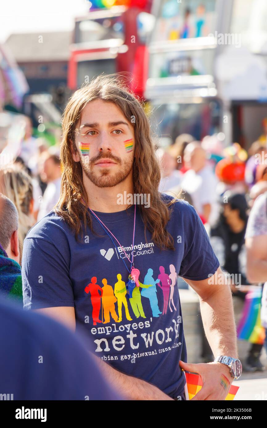 bearded young man in birmingham city council T shirt at Gay Pride parade protest 2022 in birmingham city centre uk september 24th Stock Photo
