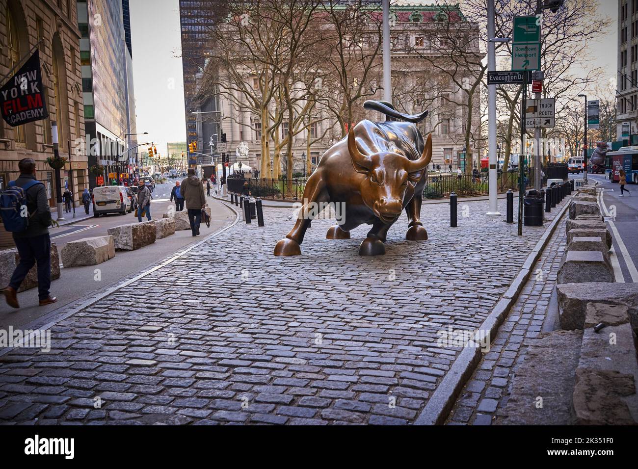 Charging Bull is a popular tourist destination that draws thousands of people, symbolizing Wall Street and the Financial District. Stock Photo