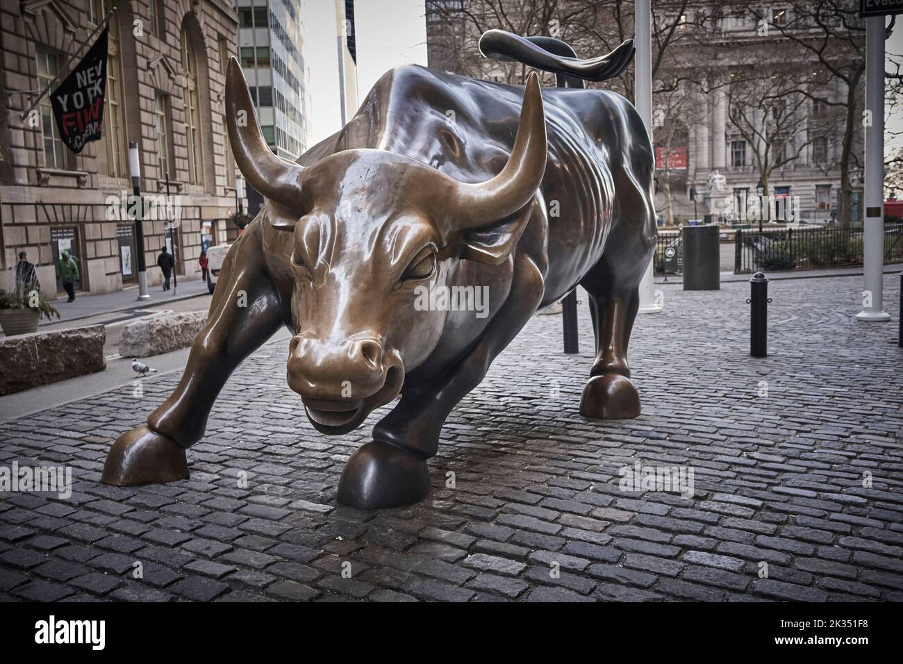 Charging Bull is a popular tourist destination that draws thousands of people, symbolizing Wall Street and the Financial District. Stock Photo