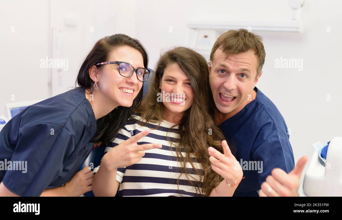 Happy young woman satisfied after dentist visit Stock Photo Alamy