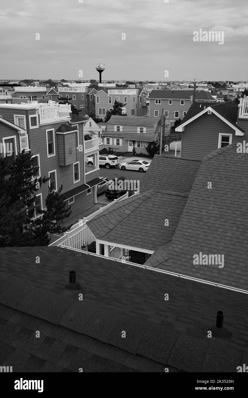 Caption:  Looking north from a 3rd story deck on Long Beach Island or LBI on the Jersey Shore.  Overcast, with view and of old and new homes. Stock Photo