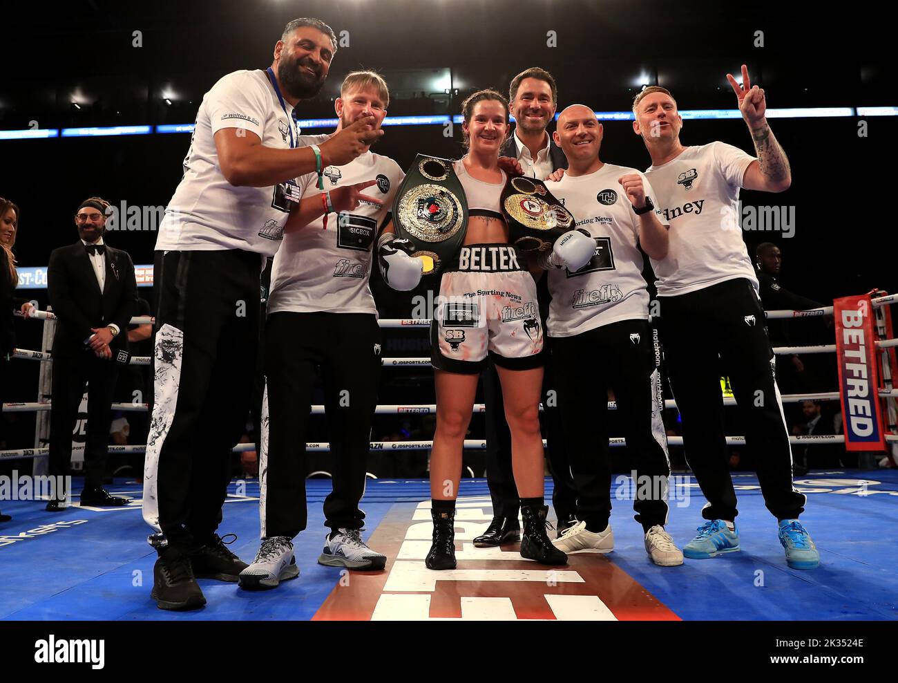 Terri Harper (centre) celebrates with team and boxing promotor Eddie Hearn after victory in the WBA and IBO World Super Welterweight titles fight against Hannah Rankin at Motorpoint Arena, Nottingham. Picture date: Saturday September 24, 2022. Stock Photo
