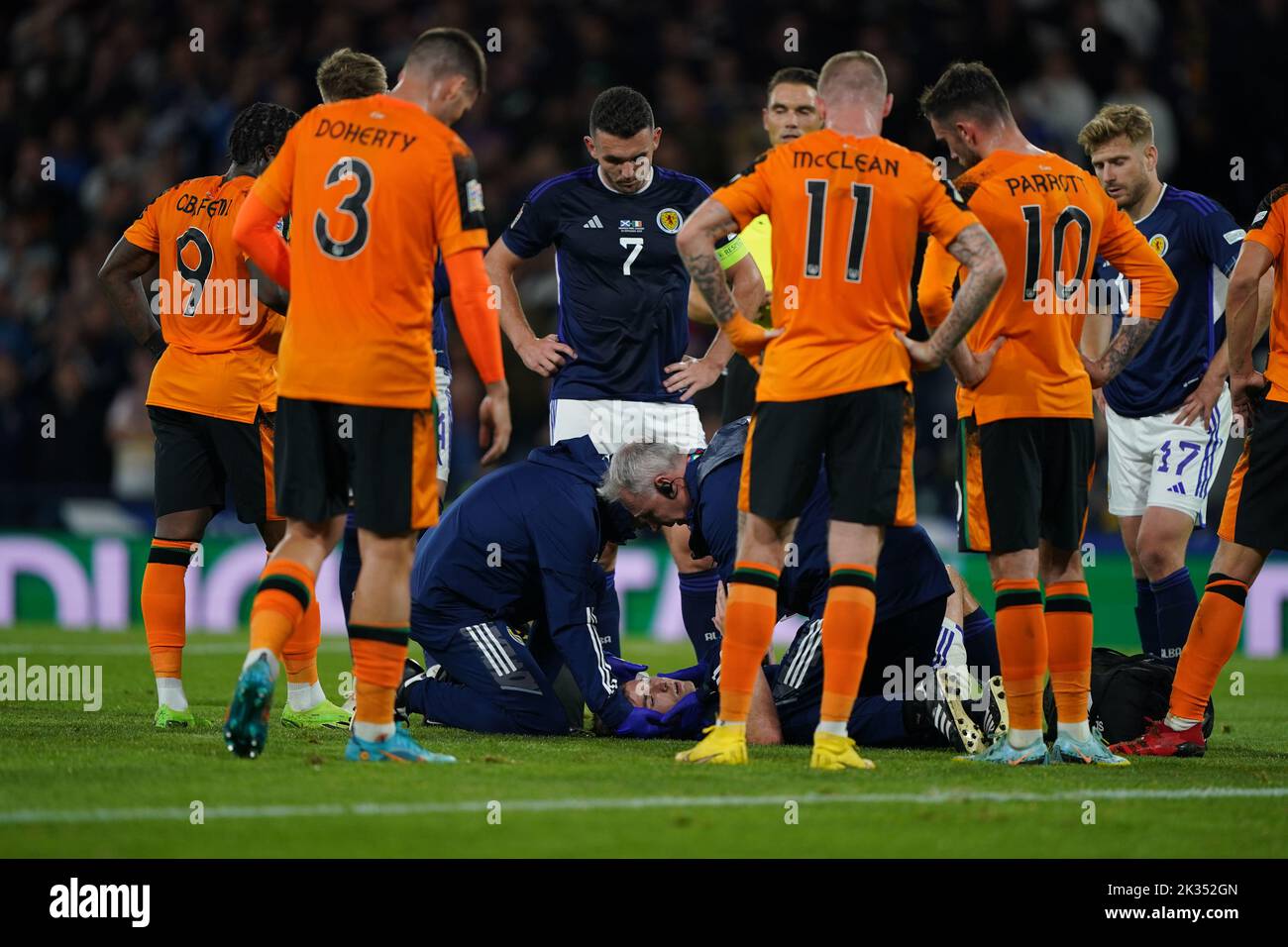 Scotland's Kieran Tierney receives treatment for an injury during the UEFA Nations League Group E Match at Hampden Park, Glasgow. Picture date: Saturday September 24, 2022. Stock Photo