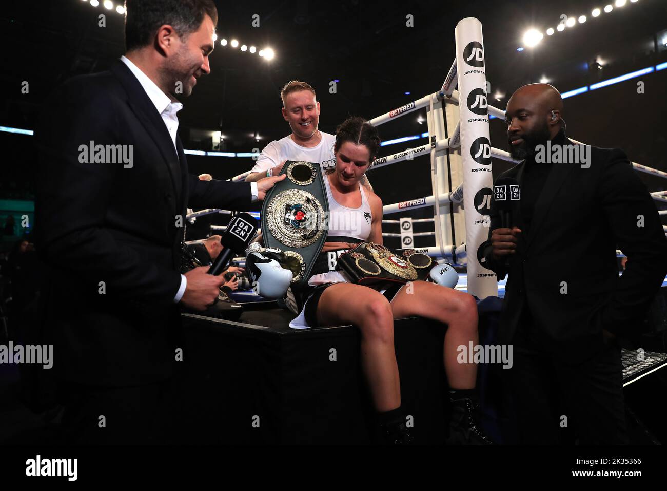 Boxing promotor Eddie Hearn (left) handsTerri Harper the belts after victory in the WBA and IBO World Super Welterweight titles fight against Hannah Rankin at Motorpoint Arena, Nottingham. Picture date: Saturday September 24, 2022. Stock Photo