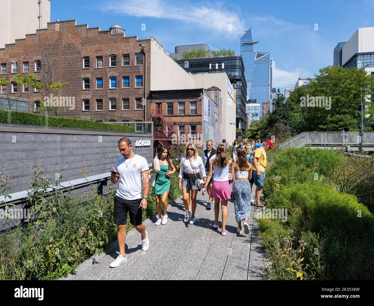 People on the High Line in Chelsea neighborhood of Manhattan Stock Photo