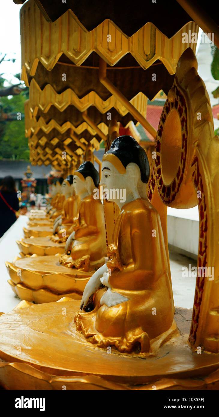A vertical shot of bronze traditional statues in China Folk Village