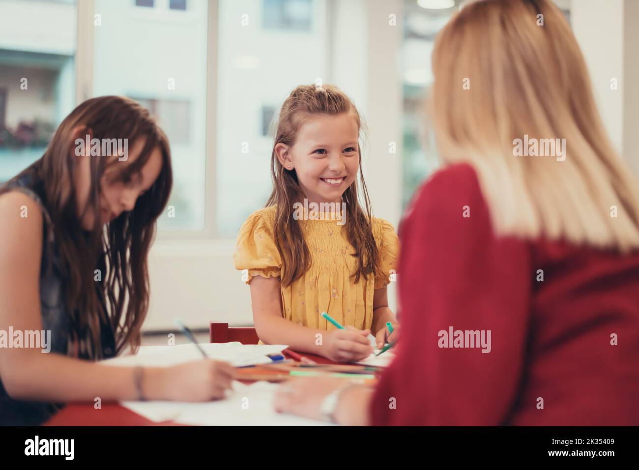 Creative kids during an art class in a daycare center or elementary ...