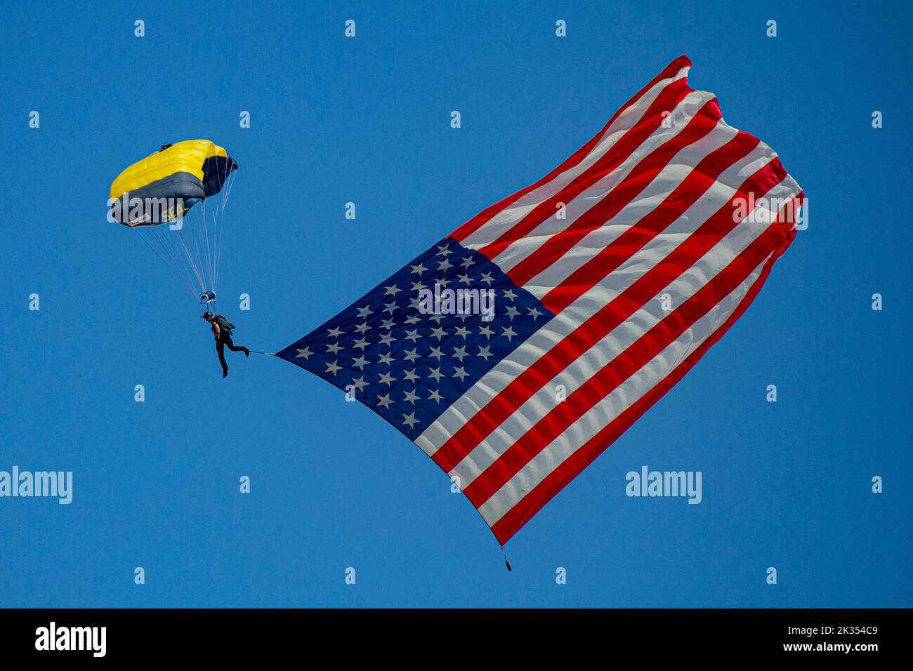 The U.S. Navy Parachute Team, nicknamed the Leap Frogs, conducts an aerial demonstration from a U.S. Army C-147A at the 2022 Marine Corps Air Station Miramar Air Show at MCAS Miramar, San Diego, California, Sept. 23, 2022. The Leap Frogs Navy Parachute Team is made up of active-duty Navy SEALs, Special Warfare Combatant-craft Crewmen and support personnel. The theme for the 2022 MCAS Miramar Air Show, “Marines Fight, Evolve and Win,” reflects the Marine Corps’ ongoing modernization efforts to prepare for future conflicts. (U.S. Marine Corps photo by Lance Cpl. Zachary Larsen) Stock Photo