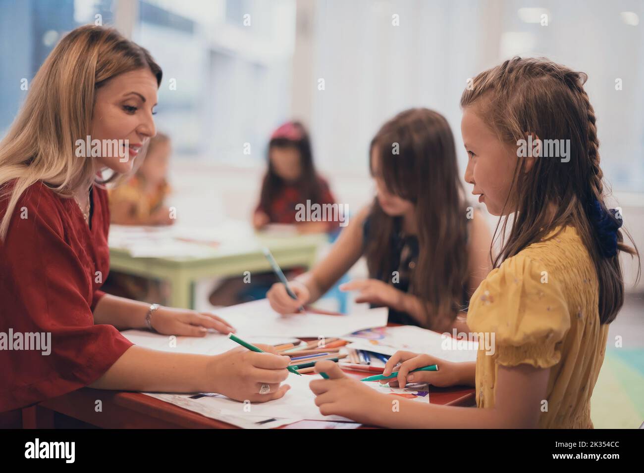 Creative kids during an art class in a daycare center or elementary ...