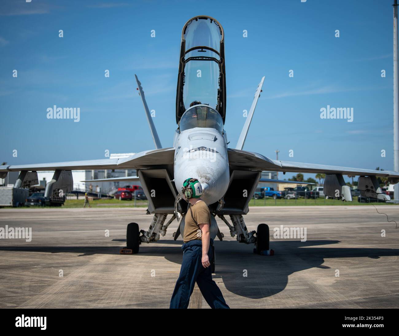 A U.S. Sailor with Strike Fighter Squadron (VFA) 2, Naval Air Station Lemoore, California, walks around an an F/A-18 Super Hornet for post-flight recovery during Weapons System Evaluation Program-East 22.12 at Tyndall Air Force Base, Florida, Sept. 12, 2022. WSEP-E 22.12 is a formal, two-week evaluation exercise designed to test a squadron’s capabilities to conduct live-fire weapons systems during air-to-air combat training missions. (U.S. Air Force photo by Senior Airman Jacob Dastas) Stock Photo