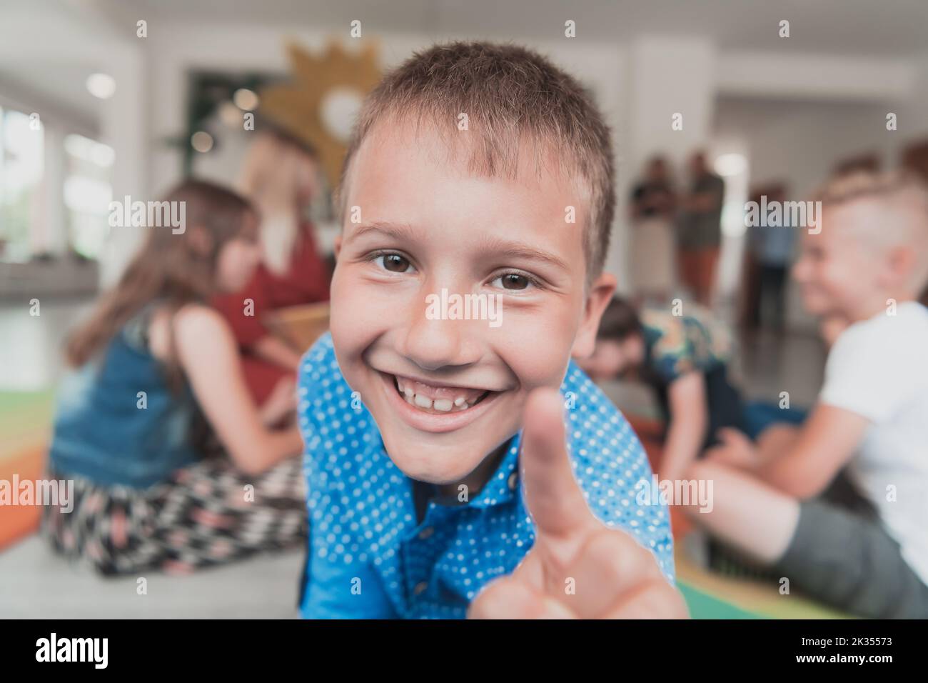 Portrait photo of a smiling boy in a preschool institution having fun ...