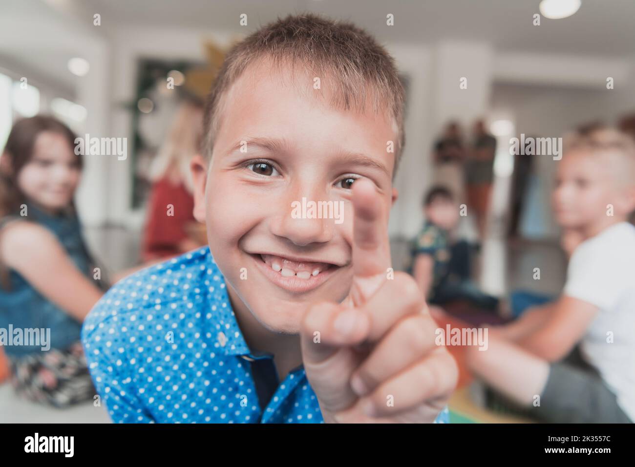Portrait photo of a smiling boy in a preschool institution having fun ...