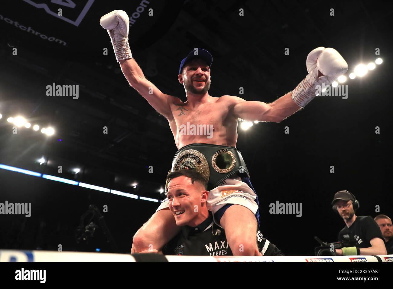 Maxi Hughes celebrates winning the IBO World Lightweight title fight against Kid Galahad with Josh Warrington (bottom) at Motorpoint Arena, Nottingham. Picture date: Saturday September 24, 2022. Stock Photo