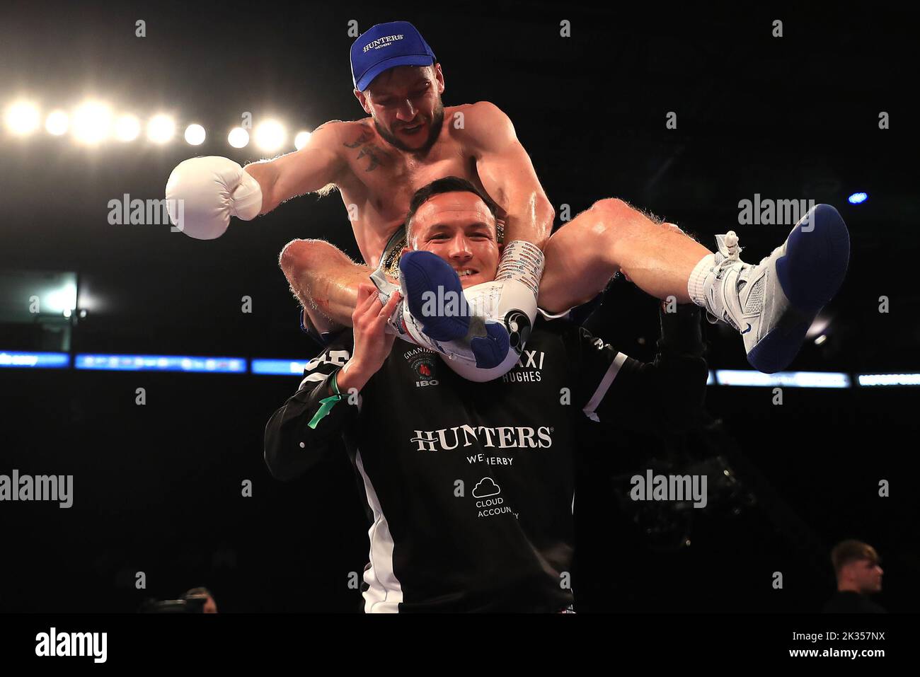 Maxi Hughes is lifted up by Josh Warrington after his victory in the IBO World Lightweight title fight against Kid Galahad at Motorpoint Arena, Nottingham. Picture date: Saturday September 24, 2022. Stock Photo