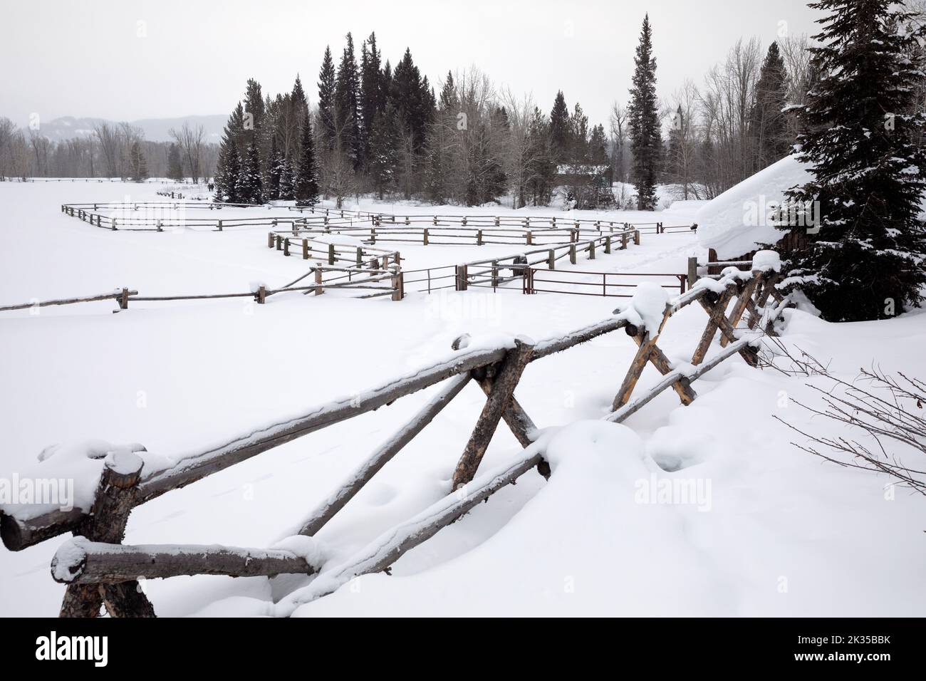 WY05061-00.....WYOMING - Snow covered and empty horse corral in Grand Teton National Park. Stock Photo