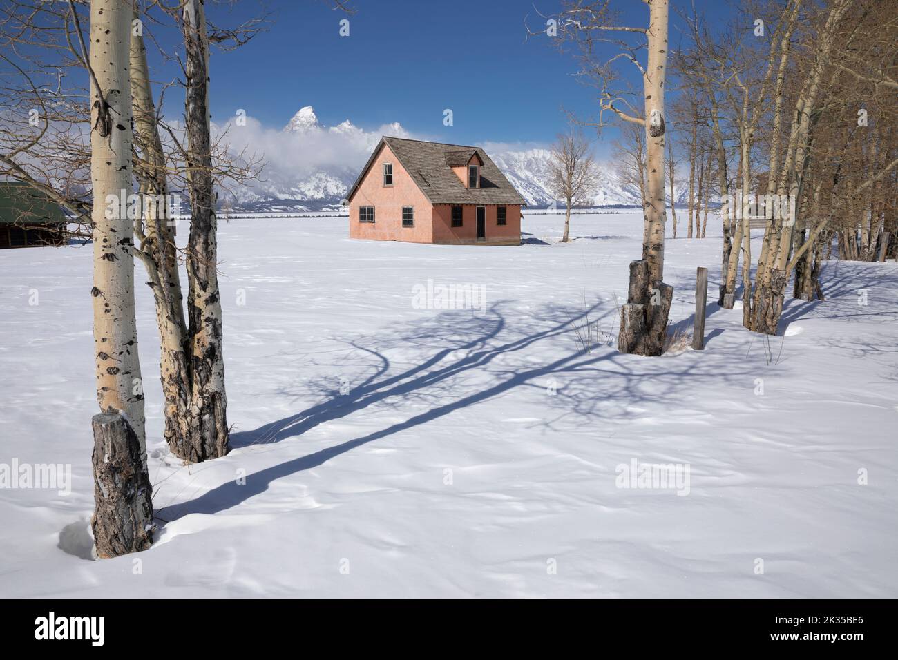 WY05070-00.....WYOMING - House with the Teton Range. Located along Mormon Row Historic Distric in Grand Teton National Park. Stock Photo