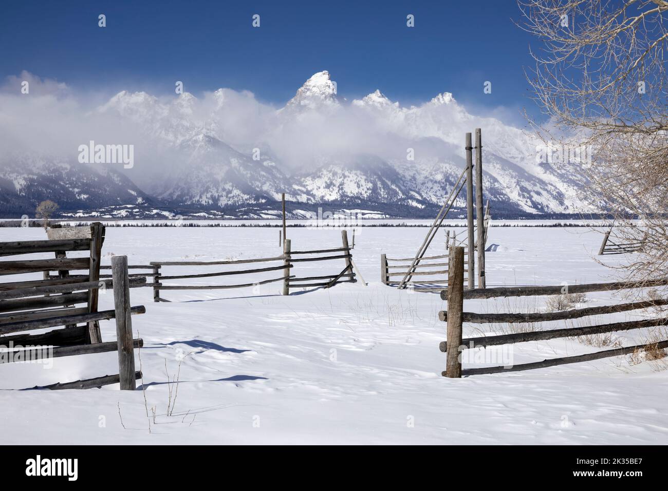 WY05071-00.....WYOMING - House with the Teton Range. Located along Mormon Row Historic Distric in Grand Teton National Park. Stock Photo